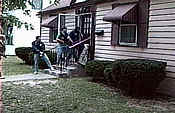 Three officers entering a house